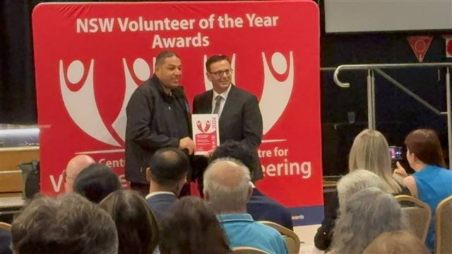 SCC team receiving a volunteer award